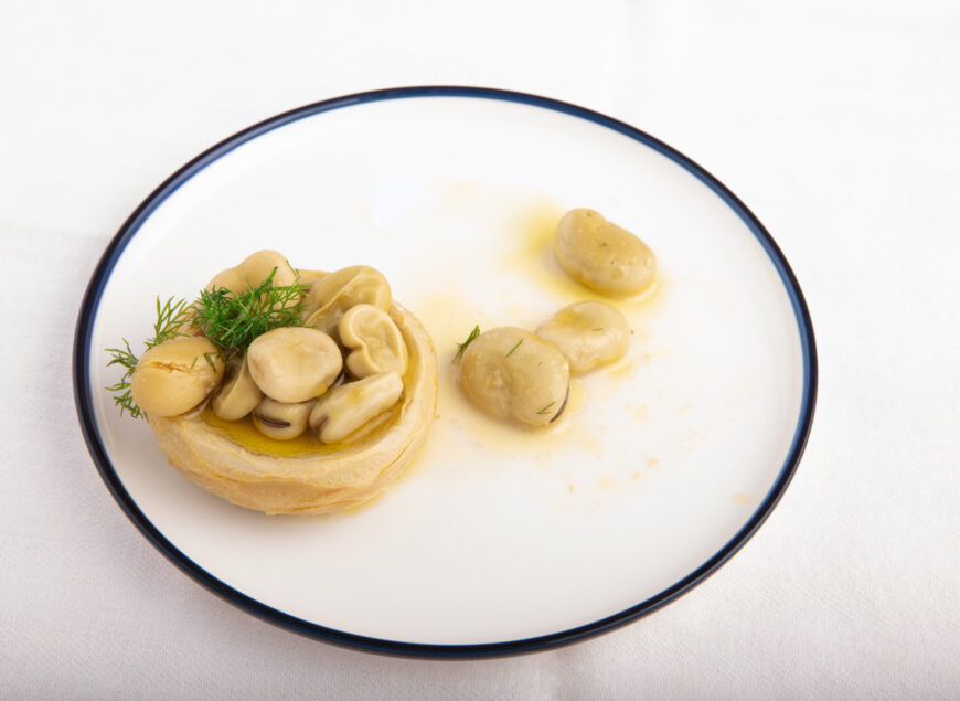 Olive oil artichoke with broad bean, vegetarian food..