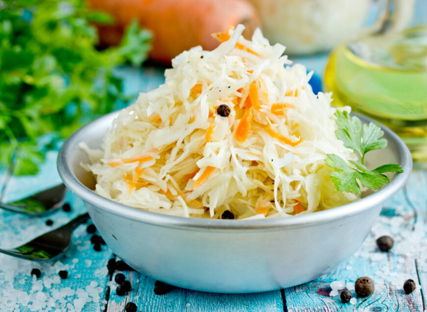 Homemade sauerkraut with carrot and spices, sweet and sour white cabbage