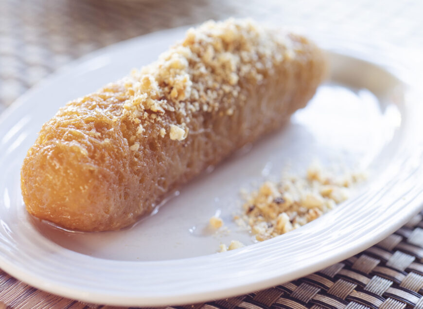 Turkish dessert from Erzurum dolma kadayifi on white plate close up